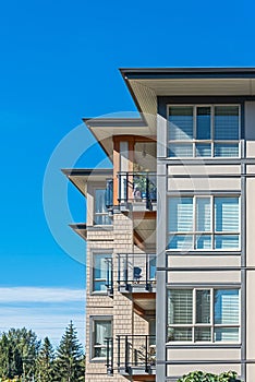 Corners of new residential building on blue sky background