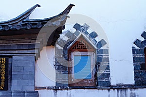 Corners of old China, a window in a old house in the historic center of Xizhou, Yunnan, China. Xizhou, Yunnan, China