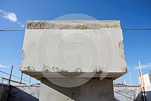 cornerstone of a building resisting the weight of upper floors