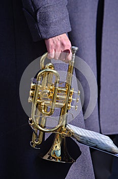 Cornet in hand.