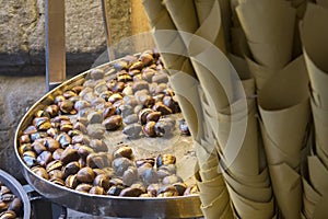 Cornet of roast chestnuts as street food