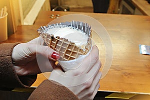 A cornettoccino,coffee with ice cream and milk in a waffle cone