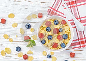Cornflakes with fresh berries raspberry and blueberry