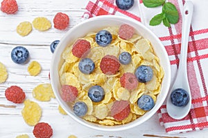 Cornflakes with fresh berries raspberry and blueberry