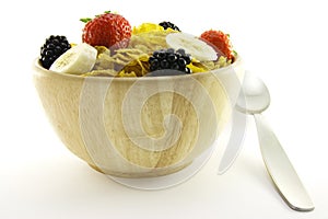 Cornflakes and Fruit in a Wooden Bowl with Spoon