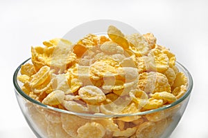 Cornflakes in a glass plate close-up. Healthy breakfast