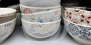 Cornflakes, porridge or oat flakes bowls on the selfservice store shelf photo