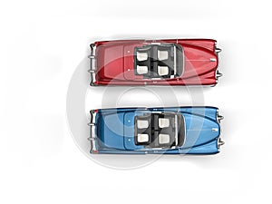 Cornflower blue and cherry red vintage cars with white wall tires - top view