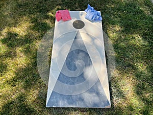 Cornhole yard game board and bean bags