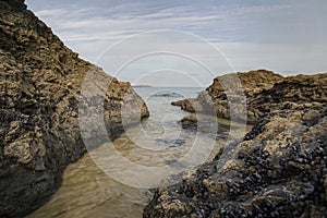 Cornish beach scene in November showing rocks and the sea