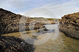 Cornish beach scene in November showing rocks and the sea