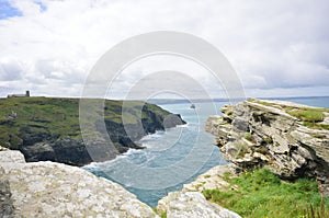 Cornish coastline in UK with rock in foreground