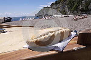 Cornish pasty on boat on beach, a picnic