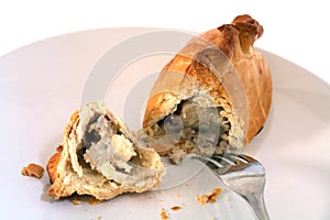 Cornish pasty broken open and fork