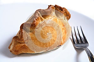 Cornish pasty meat pie and fork