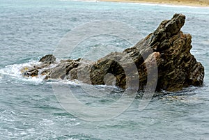 Cornish sea front, sea wall plus ocean against a beech