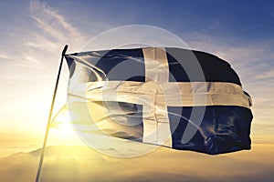 Cornwall county of England flag textile cloth fabric waving on the top sunrise mist fog