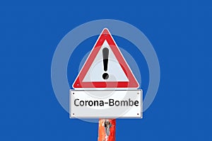 Corona bomb warning sign on blue background in german photo