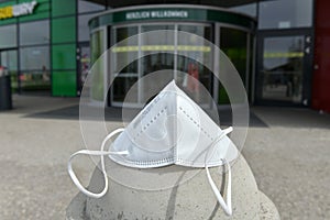 FFP2 mask in front of the entrance of a shopping center in Austria, Europe photo