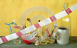 Corona lockdown of bars and pubs, utensils with warning tape on closed bar counter,