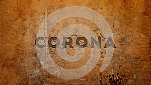 Corona and pandemic text carved on wall, shattered effect