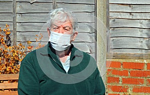Corona. Senior man face mask for protection.
