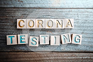 Corona Testing Written On Wooden Blocks On A Board photo