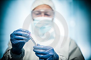 Corona virus concept. male doctor demostrating test-tube photo