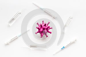 Corona virus Covid-19 - vaccine concept with syringe - on white background top-down