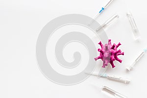 Corona virus Covid-19 - vaccine concept with syringe - on white background top-down frame copy space