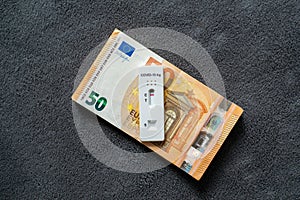 Corona virus SARS-Cov-2 antigen test on euro banknotes