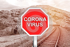 Corona virus warning sign on the railway tracks