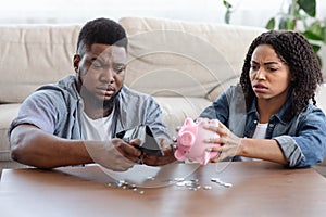 Coronacrisis Concept. Desperate African Couple Counting Last Money At Home photo