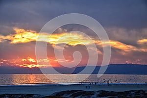 Coronado Beach in San Diego by the Historic Hotel del Coronado, at sunset with unique beach sand dunes, panorama view of the Pacif