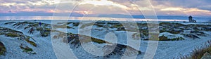 Coronado Beach in San Diego by the Historic Hotel del Coronado, at sunset with unique beach sand dunes, panorama view of the Pacif