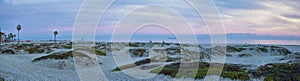 Coronado Beach in San Diego by the Historic Hotel del Coronado, at sunset with unique beach sand dunes, panorama view of the Pacif