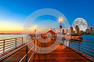 Coronado pier with full moon