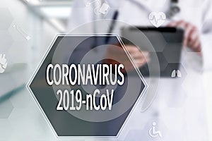 Coronavirus 2019-nCoV  words on the virtual screen on Medical Doctor in hospital background.  Coronavirus outbreak awareness