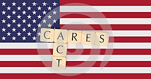 Letter Tiles CARES Act On US Flag, 3d illustration photo