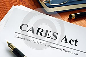 Coronavirus Aid, Relief, and Economic Security CARES Act on the desk