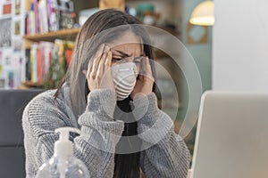 Coronavirus. Business woman working from home wearing protective mask. Business woman in quarantine for coronavirus wearing protec photo