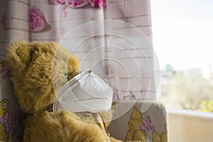 Coronavirus child: teddy bear with mask