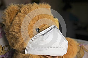 Coronavirus child: teddy bear with mask