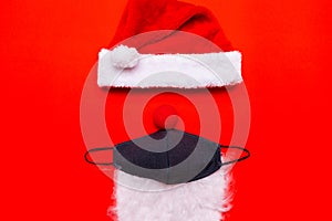 Coronavirus Christmas. Santa Claus Hat red nose Face Mask white beard.Flat lay top view