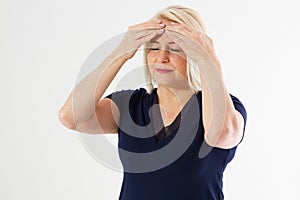 Coronavirus concept - middle-aged woman touches her forehead with her hands she have temperature and headache