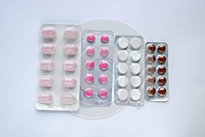 Coronavirus concept. pharmaceuticals antibiotics pills medicine colorful antibacterials pills on white background. top view