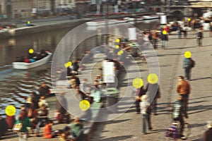 Coronavirus contact tracing, exposure detection app concept. Infected people in the crowd marked with yellow circles photo