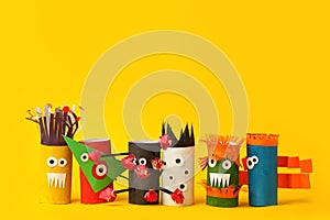 Coronavirus COVID-19 disease 2020. Paper toy monsters for Halloween party. Easy crafts for kids on yellow background, child art