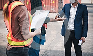 Coronavirus Covid-19 Disease Epidemic Crisis Situation, Container Shipping Worker Having Alcohol Gel Hands Cleaning Before Working