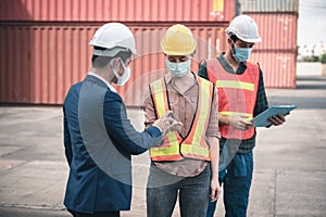 Coronavirus Covid-19 Disease Epidemic Crisis Situation, Container Shipping Worker Having Alcohol Gel Hands Cleaning Before Working